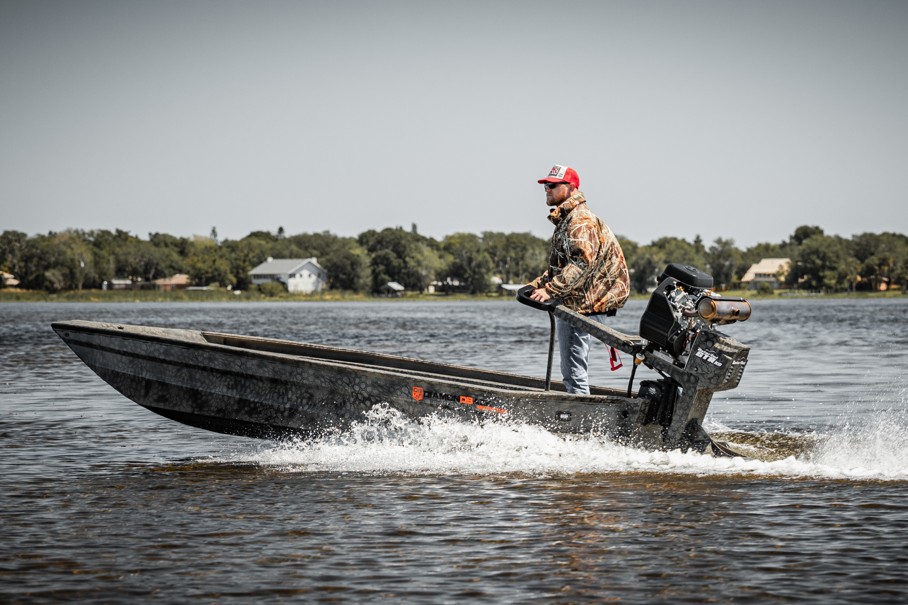 Hunter running the marsh at dawn